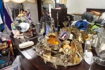 A dresser with a lot of items.